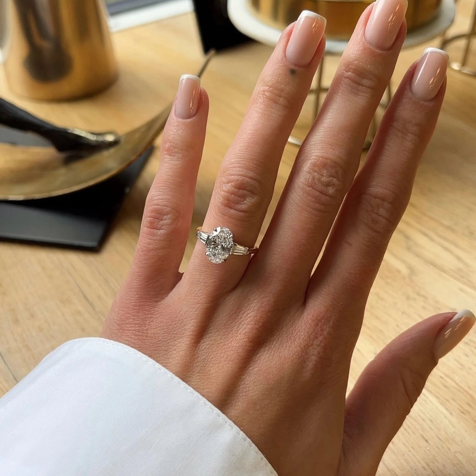 Oval Diamond Engagement Ring with Tapered Diamond Side Stones